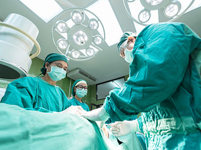 Doctors and Nurses performing surgery
